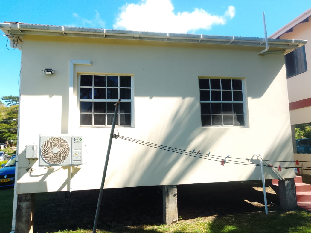 Cottage exterior with AC unit